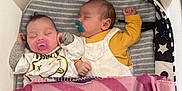 Constance a rejoint le concours — aidez-le/la à gagner de superbes lots ! baby, sleeping, pacifier, blanket, bassinet, infant, cozy, cute, toddler, clothing, striped, pink, yellow, white, indoor, resting, peaceful, child, napping, two_babies