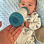 baby, blue, bottle, care, cloud_pattern, comfort, couch, cute, face, feeding, hand, infant, milk, newborn, onesie, pillow, resting, sleepwear, soft, white
