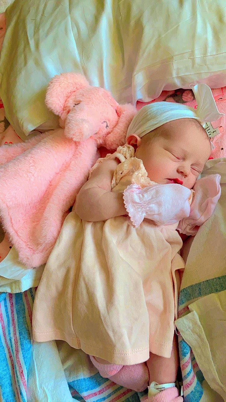 Everly joined the competition — help win amazing prizes! baby, baby_products, baby_sleeping, baby_toddler_clothing, cheek, child, comfort, event, eye, fashion_accessory, hair_accessory, happy, headband, linens, peach, person, petal, pink, sitting, skin