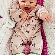 Mya joined the competition — help win amazing prizes! baby, infant, smiling, pink_clothing, headband, flower_accessory, blanket, knitted_blanket, white_booties, crawling, cute, happy, child, portrait, indoor, cozy, soft_texture, baby_girl, reaching_out, comfort