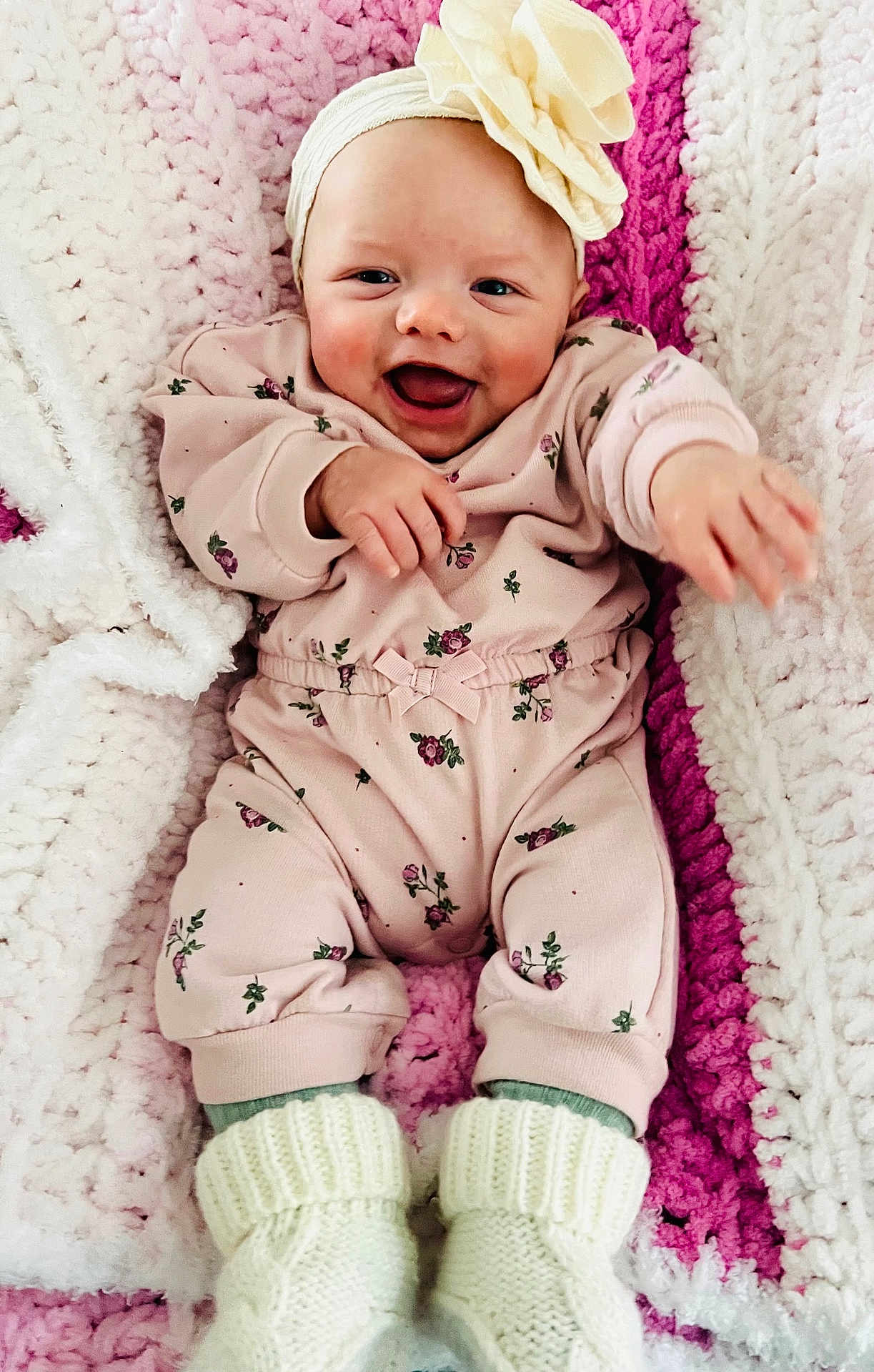 Mya joined the competition — help win amazing prizes! baby, infant, smiling, pink_clothing, headband, flower_accessory, blanket, knitted_blanket, white_booties, crawling, cute, happy, child, portrait, indoor, cozy, soft_texture, baby_girl, reaching_out, comfort