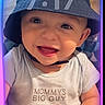 Kobe joined the competition — help win amazing prizes! baby, child, infant, smiling, happy, portrait, face, bucket_hat, hat, clothing, onesie, text_on_clothing, sitting, indoor, phone_screenshot, lock_screen, camera, colorful_lighting, close_up, person