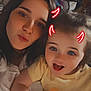child, closeup, clothing, dark_hair, face, family, filter, food, happy, indoor, light_skin, playful, portrait, red_horns, selfie, smile, snack, toddler, woman, yellow_shirt