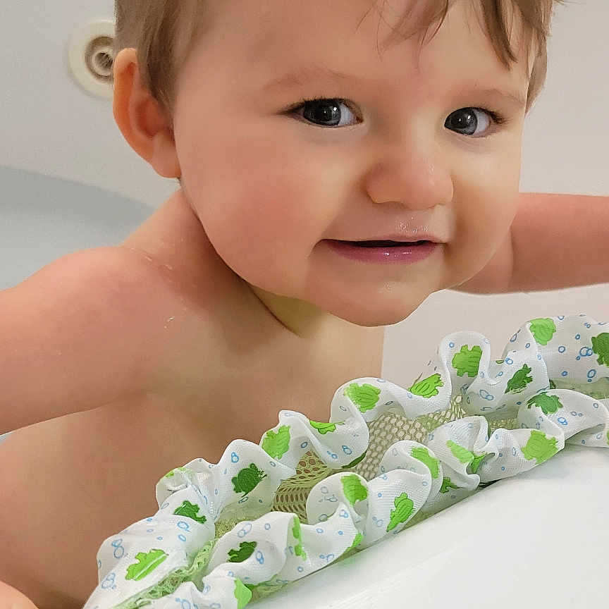 Mason is registered to the contest to win money with this photo: baby, ball, basketball, basketballball, bathing, bathtub, bodypart, face, finger, hand, happy, head, mouth, person, photography, portrait, smile, sport, teeth, tub