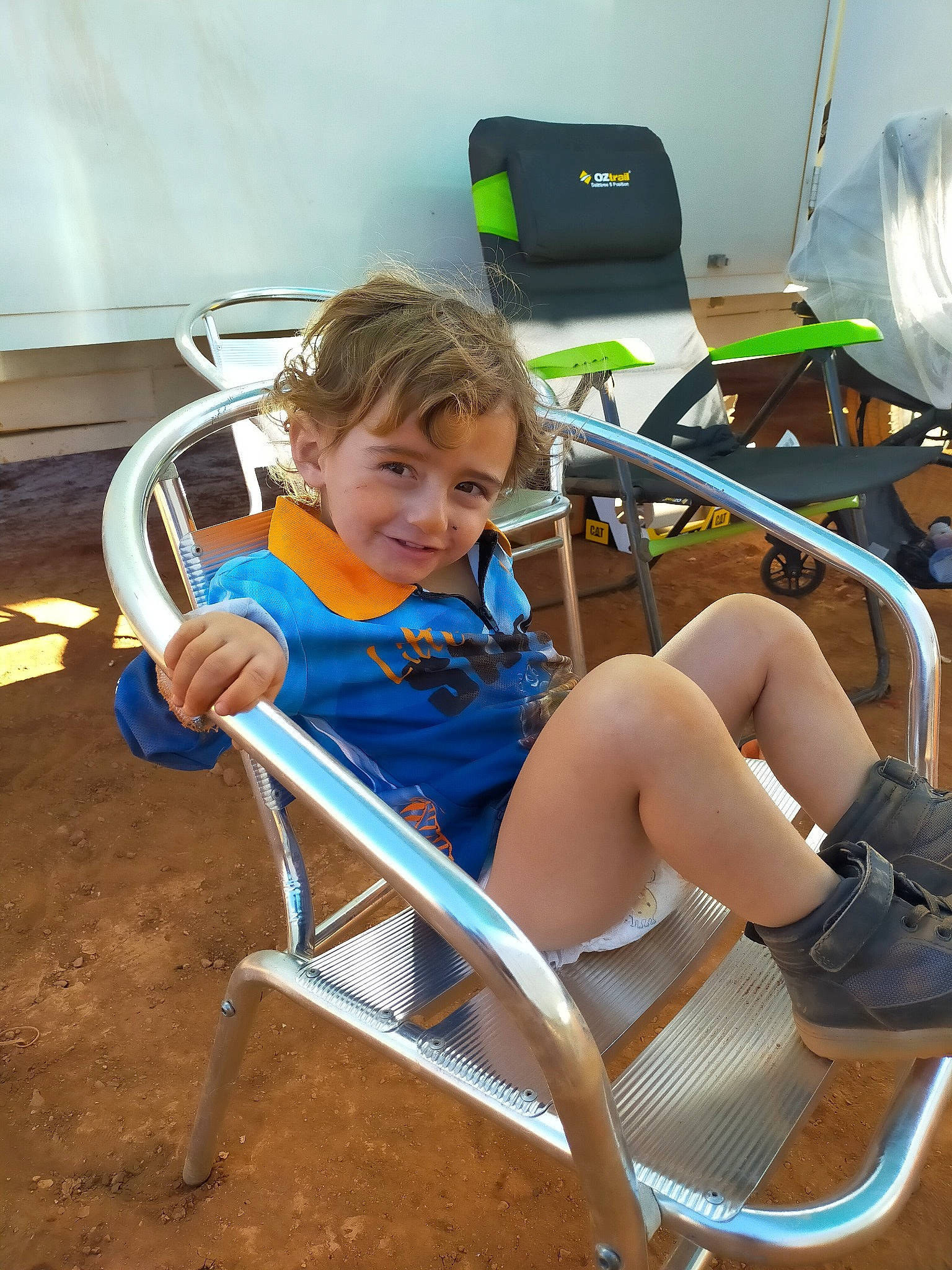 Lewis is registered to the contest to win money with this photo: chair, child, fun, joy, leg, leisure, person, sitting, thigh, toddler, vacation