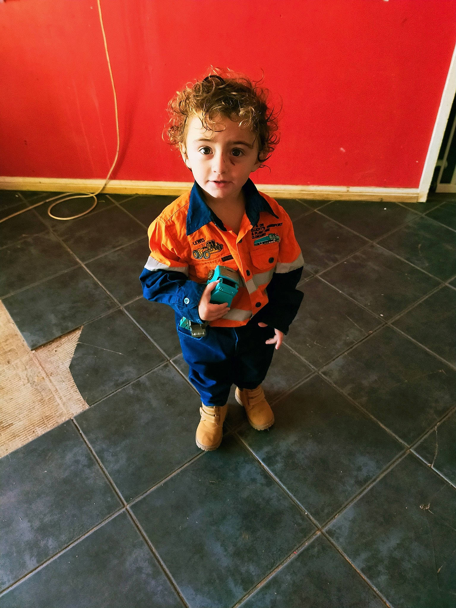 Lewis is registered to the contest to win money with this photo: child, floor, flooring, person, play, toddler