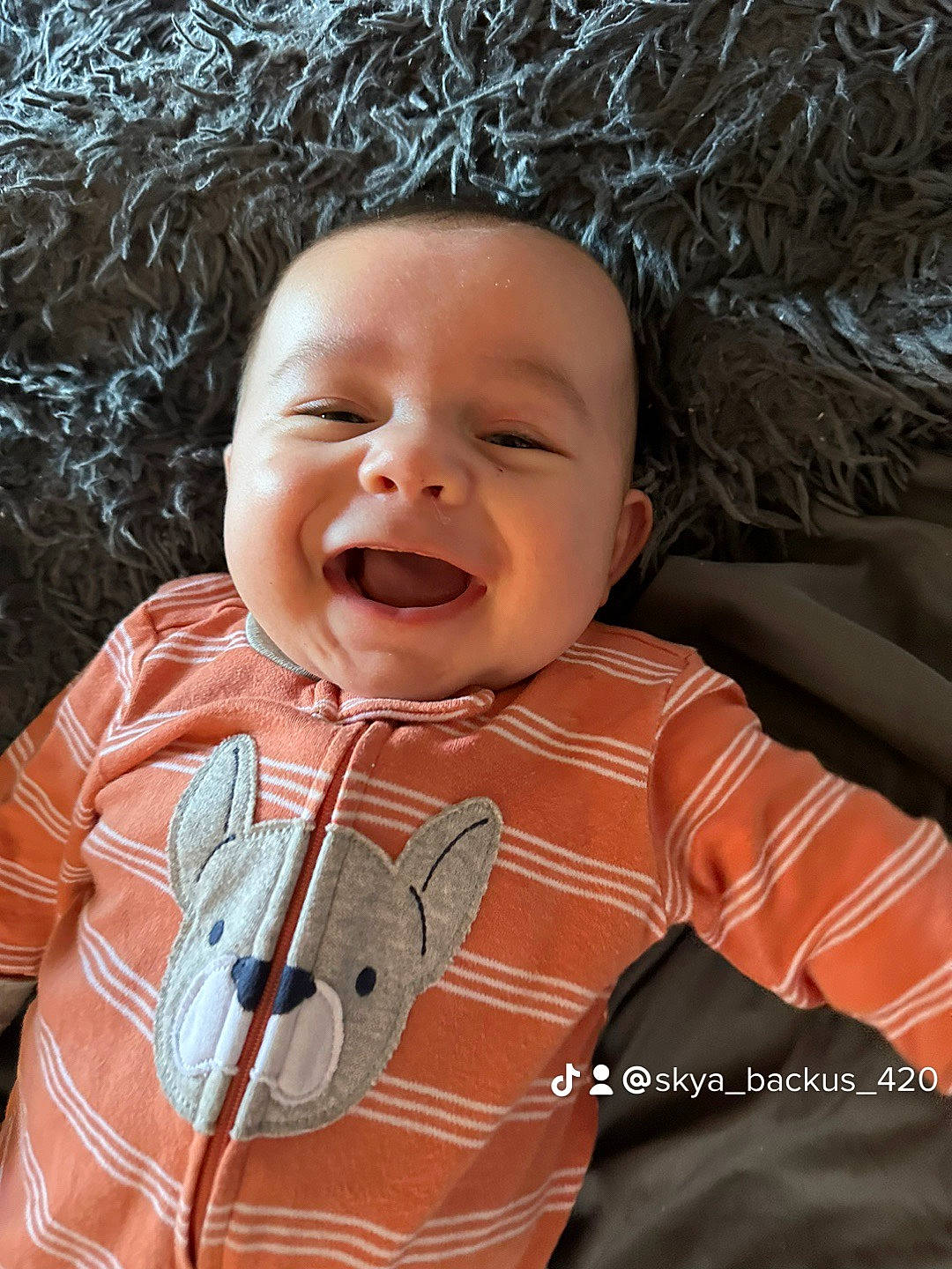 Azriel joined the competition — help win amazing prizes! baby, baby_laughing, baby_toddler_clothing, cheek, chin, eye, face, fun, grass, happy, head, human_body, iris, mouth, nose, person, skin, sleeve, smile, textile