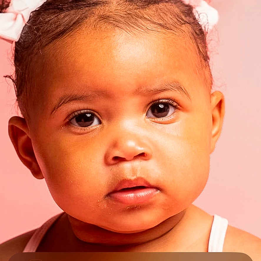 Kyler joined the competition — help win amazing prizes! app_icons, child, closeup, cute, digital_overlay, expression, eyes, face, girl, groomed_hair, hair_bows, lock_screen, notification, phone_screen, pink_background, portrait, skin, tank_top, time_display, toddler