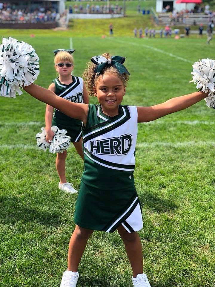 Chasity is registered to the contest to win money with this photo: ball_game, championship, cheering, cheerleading, cheerleading_uniform, joy, person, player, sports, sports_equipment, sports_uniform, team_sport, tournament, uniform