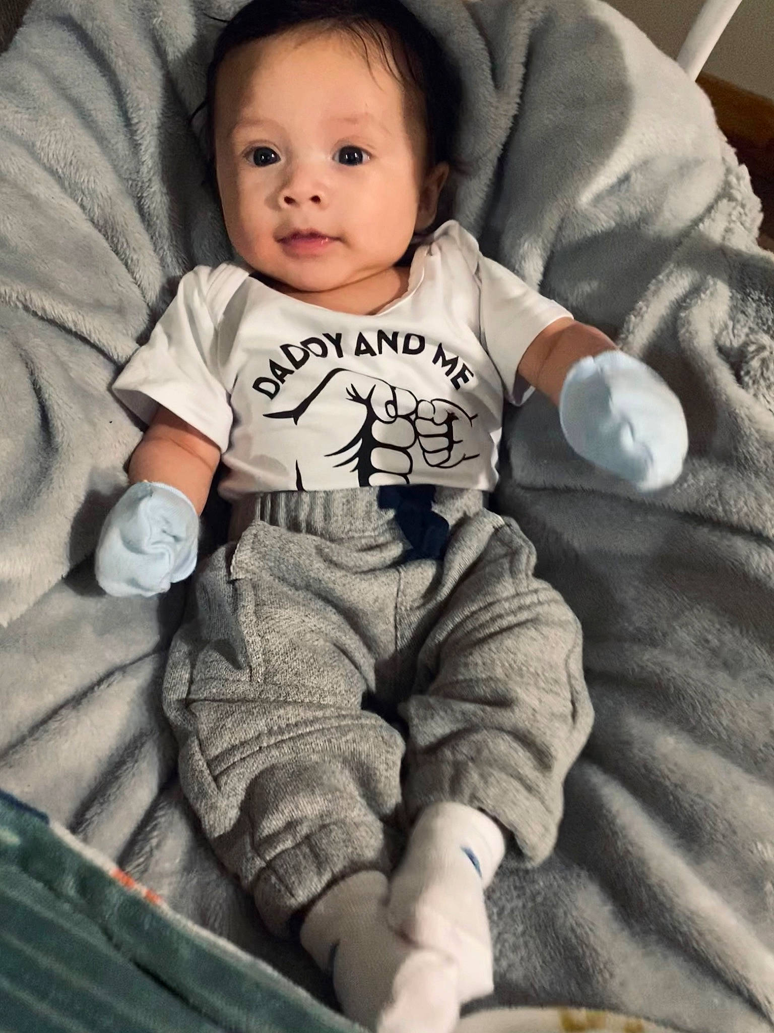 Cruz is registered to the contest to win money with this photo: arm, baby, baby_toddler_clothing, cheek, comfort, cool, face, finger, flash_photography, hairstyle, hand, happy, organ, person, photograph, skin, sleeve, standing, style, t_shirt