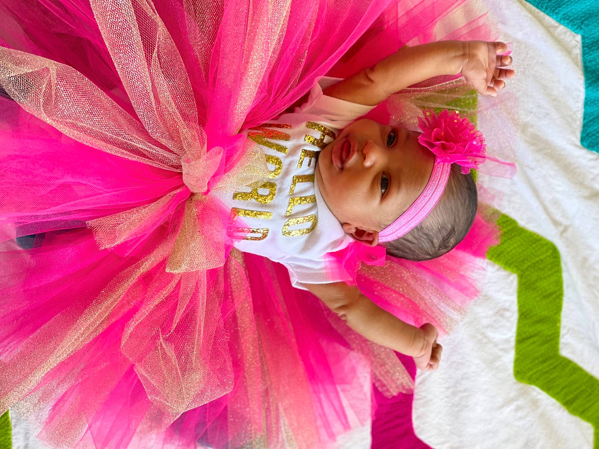 Caliana is registered to the contest to win money with this photo: baby, baby_toddler_clothing, child, costume, dress, event, fashion_design, flower, fun, happy, headwear, human_body, leisure, magenta, mythical_creature, peach, person, petal, pink, plant