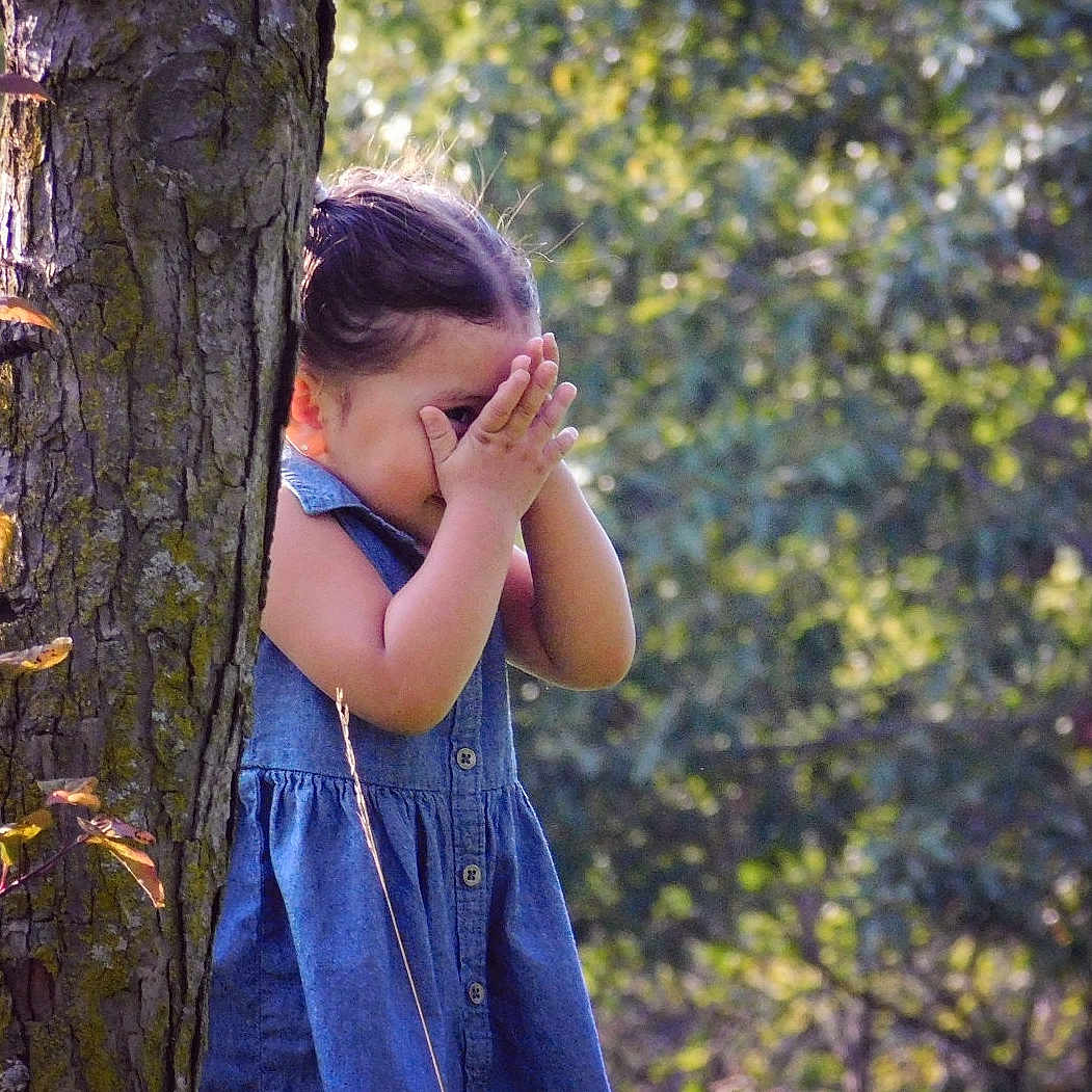 Samaya is registered to the contest to win money with this photo: autumn, beauty, black_hair, blue, child, emotion, eye, fun, girl, grass, happiness, long_hair, nature, photograph, photography, plant, portrait_photography, smile, standing, tree