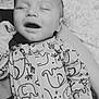 animal_print, baby, child, closeup, comfort, cute, elephant, face, happy, infant, monochrome, newborn, onesie, patterned_clothing, person, resting, sleeping, sleepwear, smiling, soft
