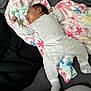 Elaiya joined the competition — help win amazing prizes! baby, blanket, cozy, cute, face, floral_pattern, gray_clothing, head, indoors, infant, lying_down, pajamas, peaceful, person, resting, sleeping, small_fingers, soft_fabric, striped_socks, toddler