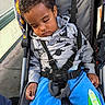 Omari joined the competition — help win amazing prizes! blue_pants, casual_clothing, child, curly_hair, cute, daylight, hoodie, outdoor, peaceful, person, portrait, relaxed, seat_belt, sidewalk, sleeping, straps, stroller, toddler, urban, young