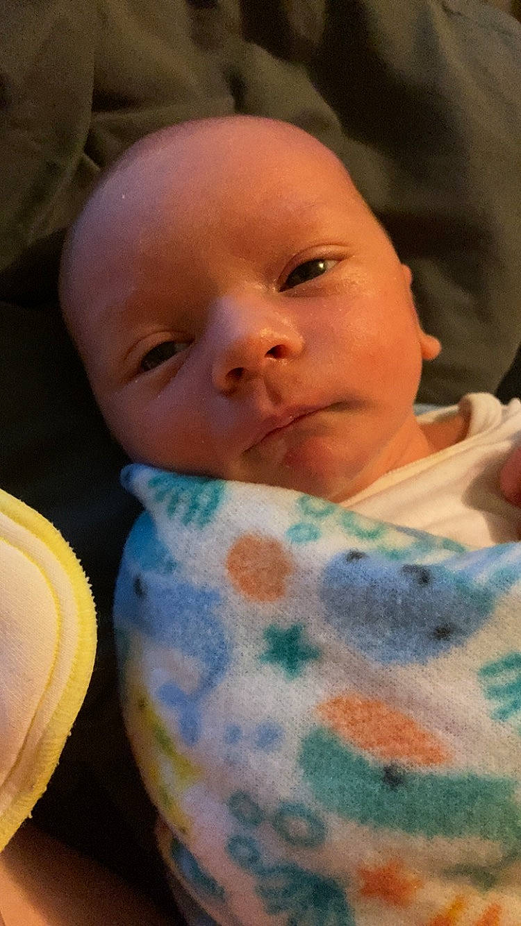 Lucas is registered to the contest to win money with this photo: baby, baby_toddler_clothing, bib, cheek, child, chin, comfort, linens, nose, pattern, person, skin, toddler