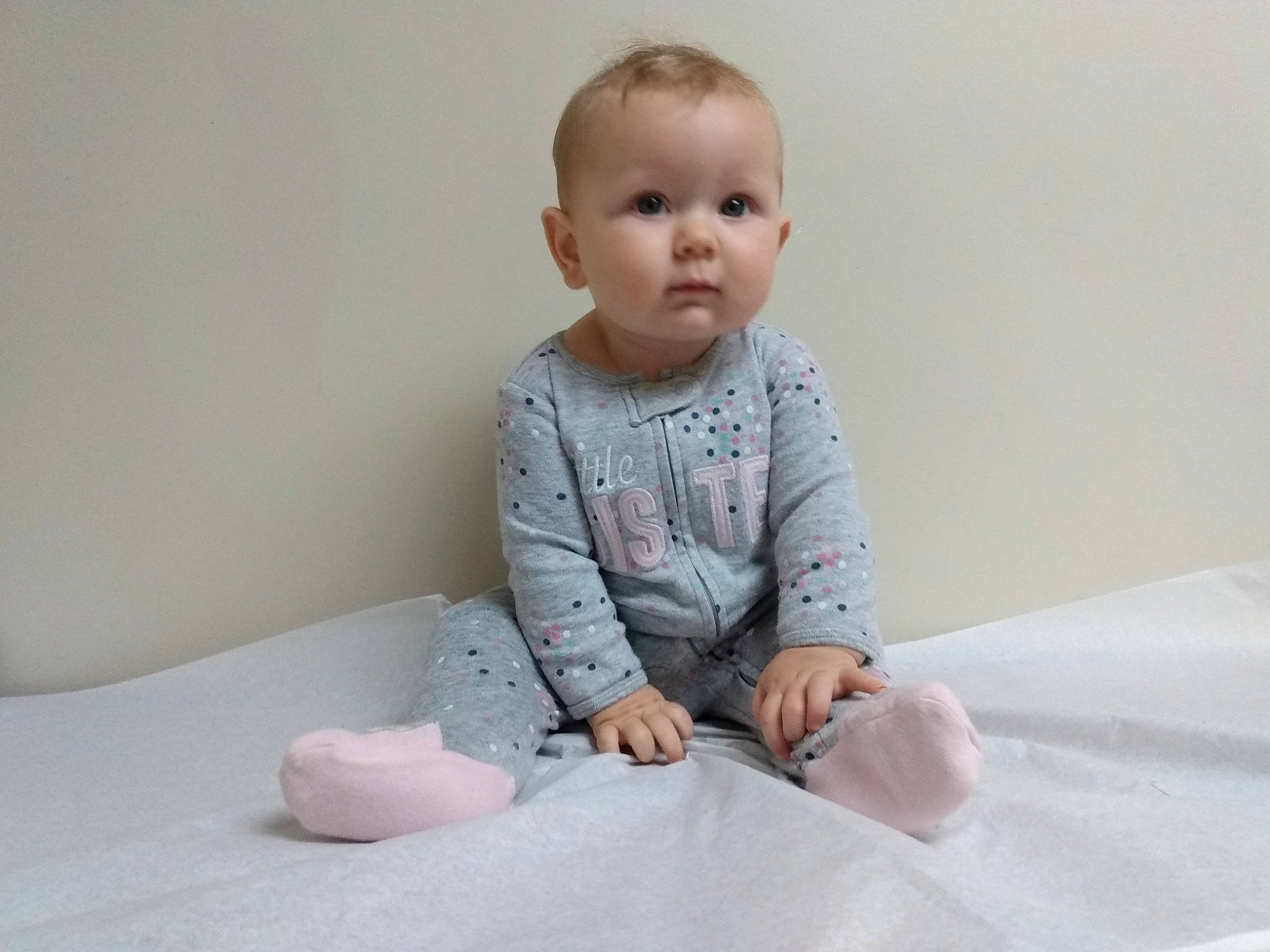 Lilah joined the competition — help win amazing prizes! ankle, baby, baby_toddler_clothing, cheek, child, comfort, ear, finger, foot, human_body, linens, person, pink, sitting, skin, sleeve, toddler