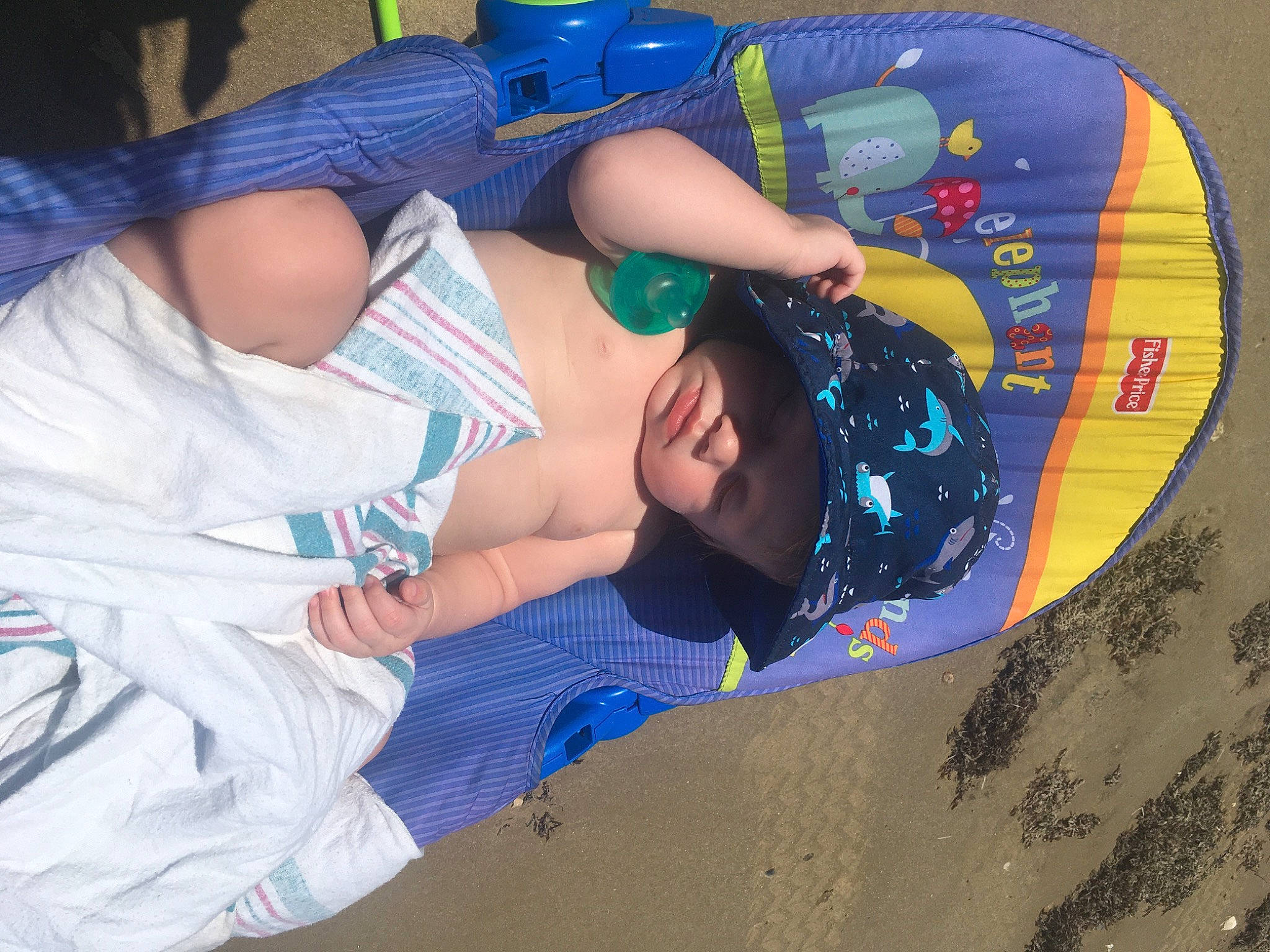 Graysen joined the competition — help win amazing prizes! baby, baby_products, baby_toddler_clothing, beach, child, comfort, elbow, electric_blue, fashion_accessory, fun, happy, hat, headwear, human_leg, leisure, pattern, person, thigh, toddler, vacation