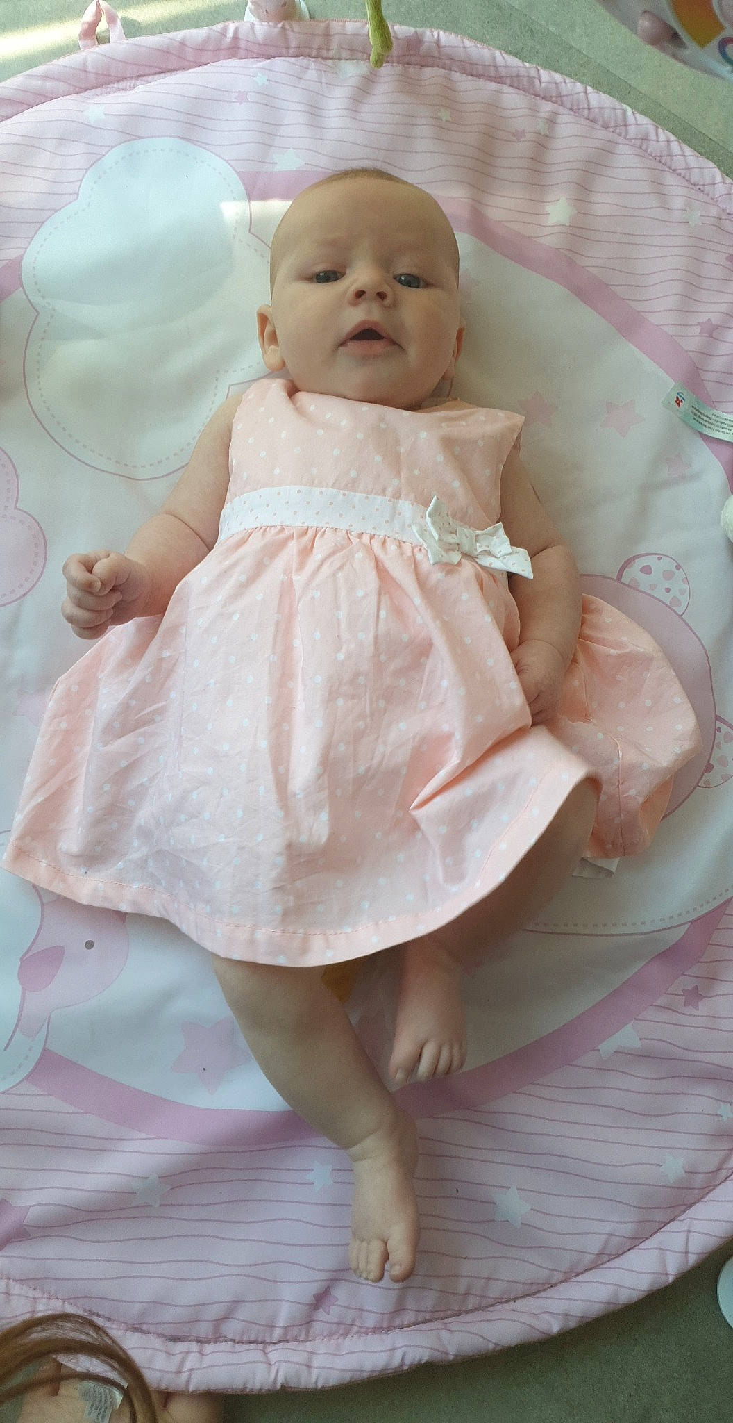 Salomé participe au concours pour gagner de l'argent avec cette photo : baby, baby_toddler_clothing, bridal_accessory, cheek, child, day_dress, doll, dress, embellishment, eye, head, iris, one_piece_garment, pattern, peach, person, pink, skin, sleeve, toddler
