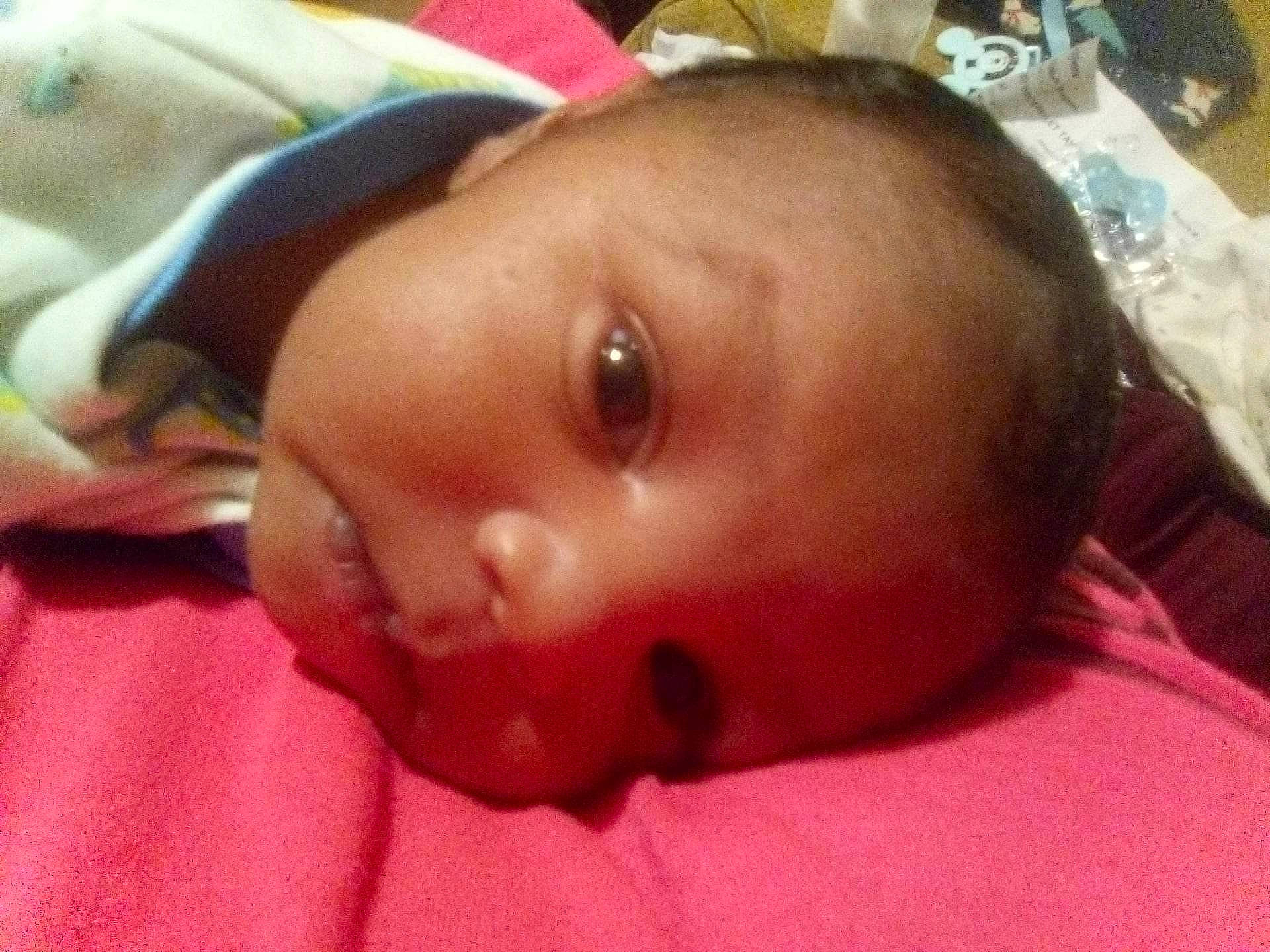 Kyrie is registered to the contest to win money with this photo: baby, baby_safety, baby_toddler_clothing, cheek, child, chin, comfort, eyebrow, eyelash, fun, happy, head, human_body, lip, mouth, nose, person, room, skin, smile