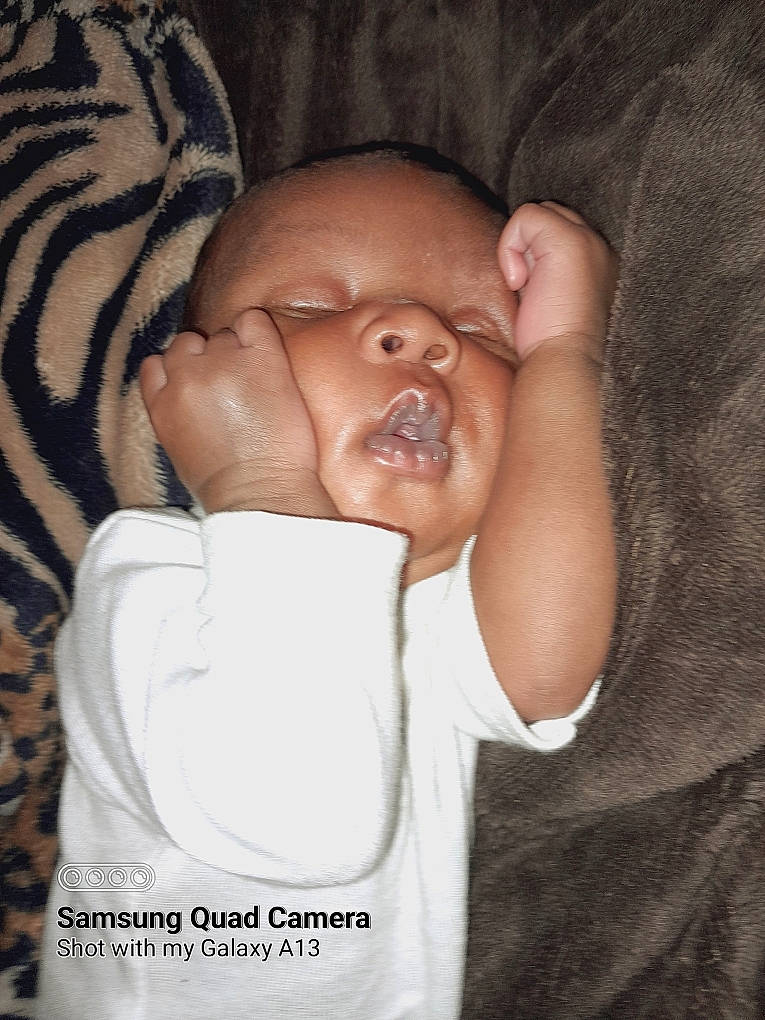 Kyrie joined the competition — help win amazing prizes! baby_toddler_clothing, cheek, chin, comfort, ear, eye, face, finger, forehead, gesture, hand, head, jaw, lip, mouth, neck, nose, person, skin, sleeve