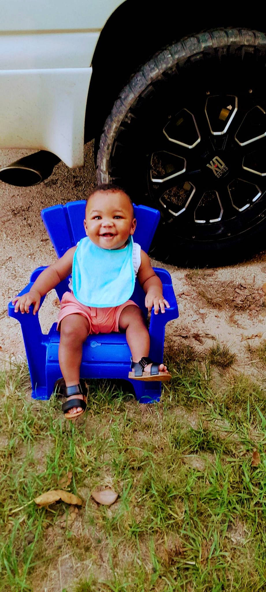 Kyrie joined the competition — help win amazing prizes! automotive_tire, azure, baby, baby_toddler_clothing, blue, electric_blue, flash_photography, grass, happy, hat, joy, leisure, motor_vehicle, people_in_nature, person, shoe, shorts, smile, sneakers, tire