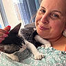 Bella participe au concours pour gagner de l'argent avec cette photo : woman, cat, indoor, closeup, smile, pet, comfort, natural_light, curtains, window, relaxation, face, hand, nail_polish, feline, casual_clothing, portrait, domestic, happy, resting
