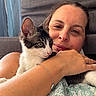 woman, cat, kitten, close_up, indoor, bed, couch, curtains, snuggling, pet, cute, relaxed, portrait, human, animal, feline, comfort, home, affection, casual