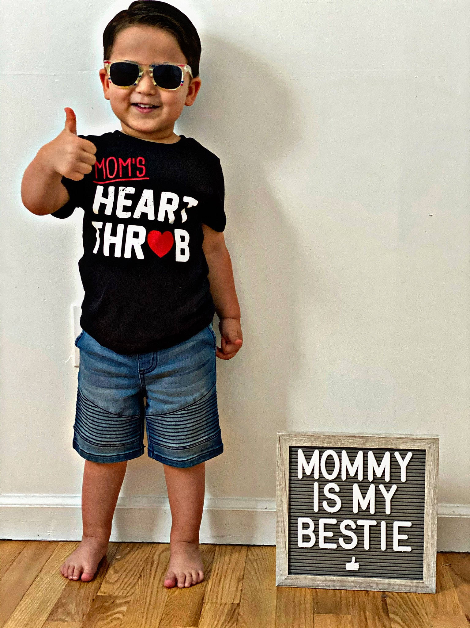 Mattaeo is registered to the contest to win money with this photo: child, clothing, cool, eyewear, font, glasses, jeans, joy, muscle, person, shorts, sleeve, t_shirt, toddler, top