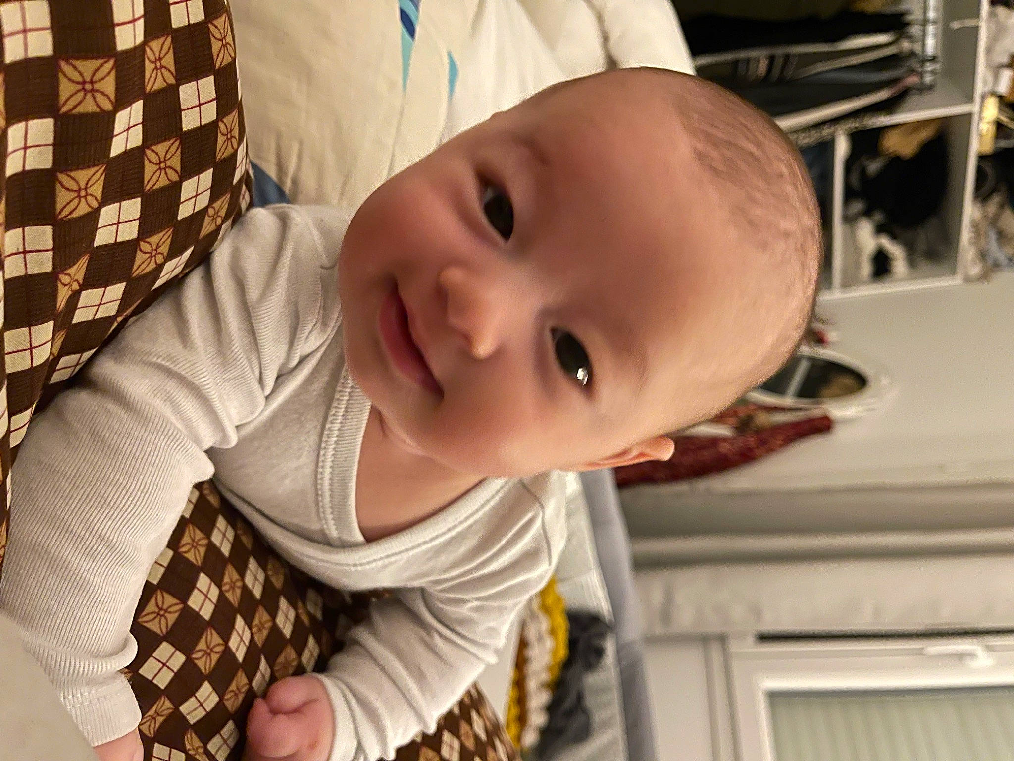 Eden participe au concours pour gagner de l'argent avec cette photo : baby, baby_toddler_clothing, cheek, child, chin, dress, happy, human_body, iris, lip, mouth, nose, pattern, person, plant, skin, sleeve, smile, tartan, toddler