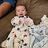 baby, infant, smile, sleeper, stars, blanket, couch, leather, person, arm, happy, cozy, indoor, child, cute, comfortable, clothing, relaxing, portrait, home