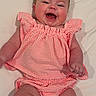 Landrie joined the competition — help win amazing prizes! baby, smiling, infant, pink_clothing, striped_outfit, happy, cute, lying_down, white_background, chubby_arms, chubby_legs, portrait, child, young, joyful, human, one_person, indoors, casual, playful