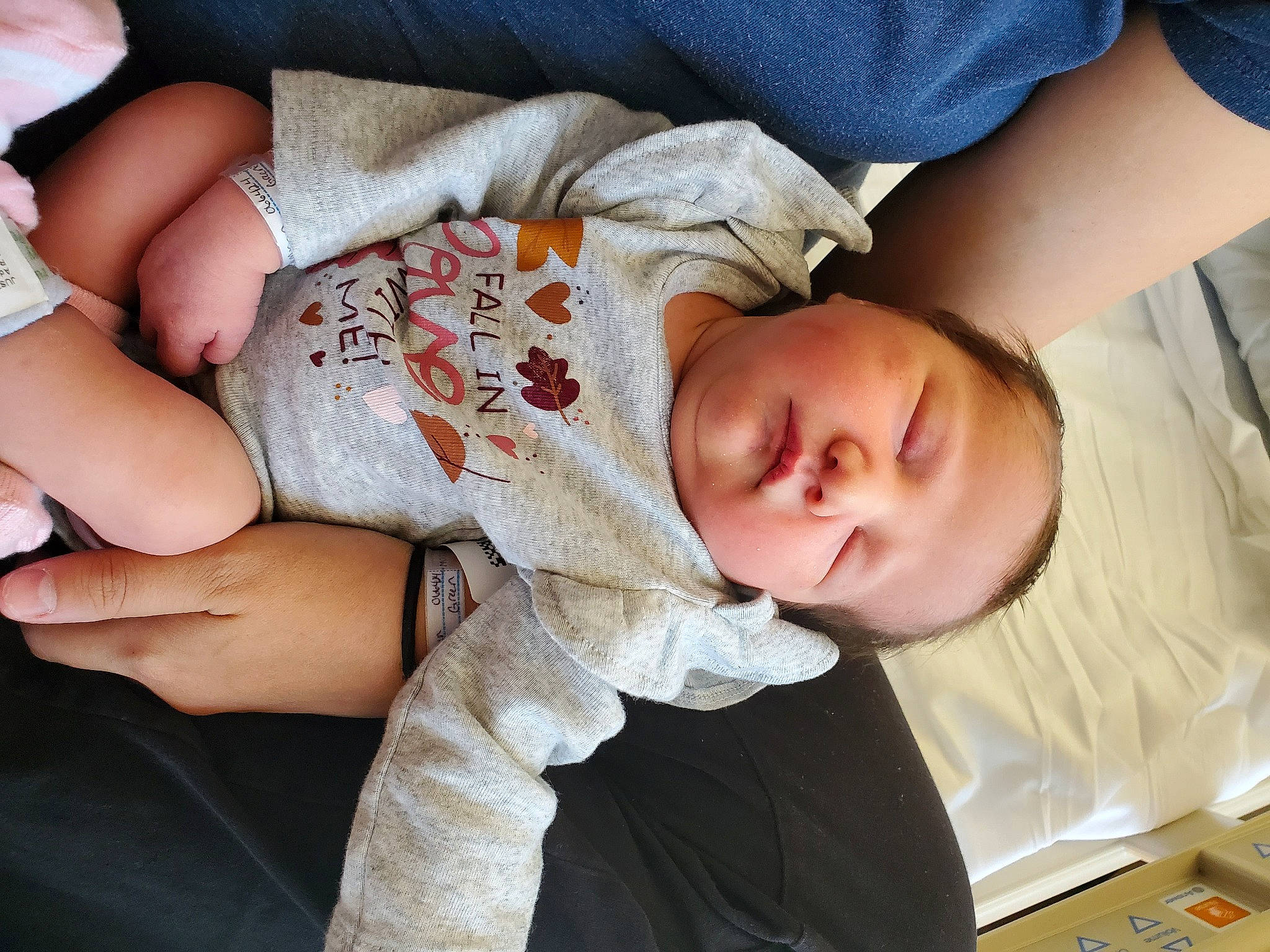 Alyson is registered to the contest to win money with this photo: arm, baby, baby_toddler_clothing, cheek, child, comfort, elbow, eye, finger, gesture, hand, head, human_body, mouth, muscle, nose, person, skin, sleeve, thigh