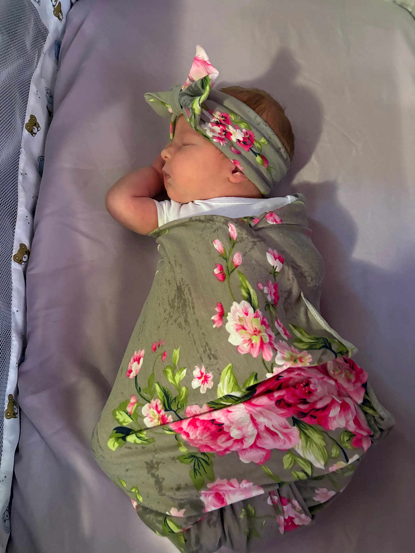 Nova joined the competition — help win amazing prizes! baby, sleeping, swaddled, blanket, headband, floral_pattern, crib, teddy_bear, soft, peaceful, infant, cute, cozy, bed, purple, child, portrait, wrapped, newborn, resting