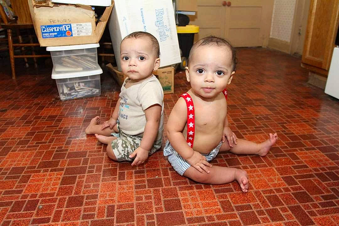 Atticus Matias joined the competition — help win amazing prizes! baby, baby_toddler_clothing, brick, brickwork, cabinetry, child, eye, floor, flooring, foot, fun, happy, hardwood, home_appliance, mammal, person, room, shipping_box, skin, toddler