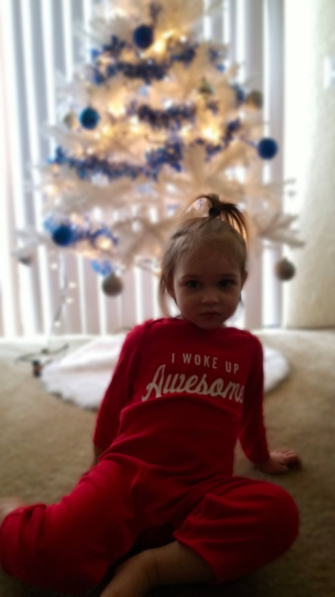 Scarlett is registered to the contest to win money with this photo: baby_toddler_clothing, child, christmas, christmas_decoration, christmas_ornament, christmas_tree, event, fun, happy, holiday, holiday_ornament, lighting, ornament, people, person, sleeve, standing, toddler, white, winter