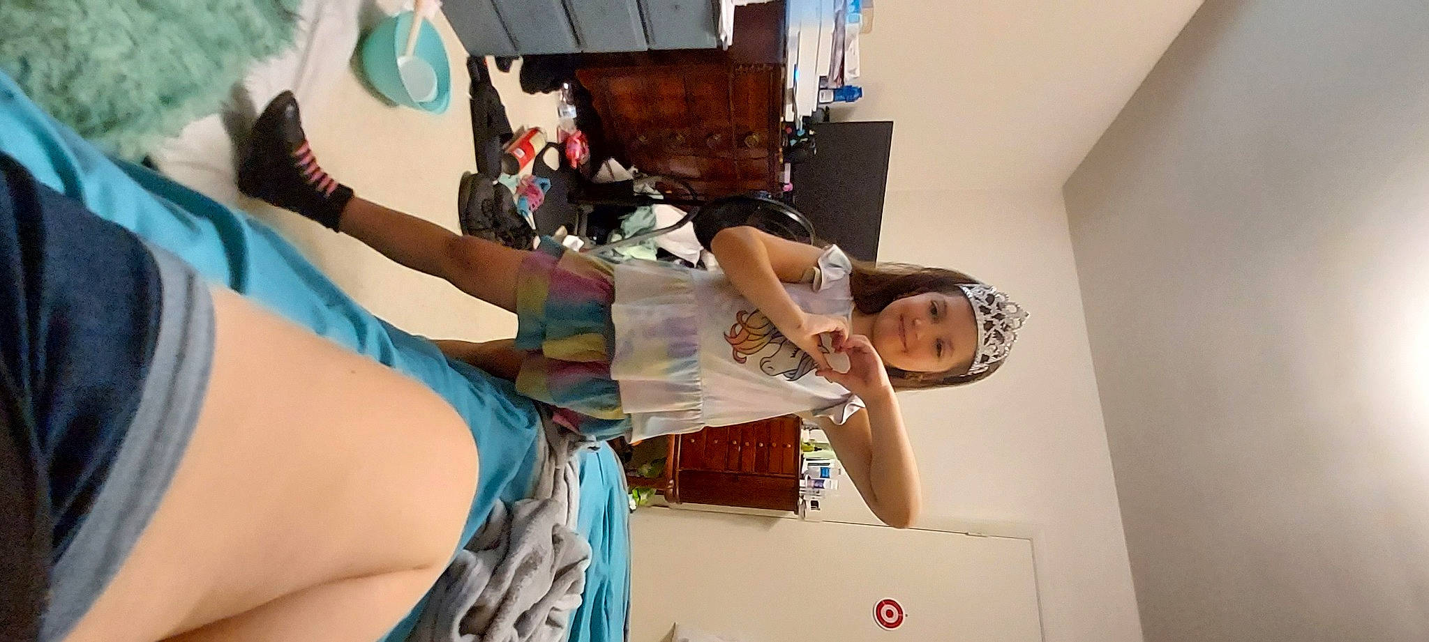 Sara is registered to the contest to win money with this photo: art, elbow, event, eyewear, fashion, fashion_design, fun, headwear, human_leg, joy, leisure, person, room, t_shirt, thigh, visual_arts, wood, wrist