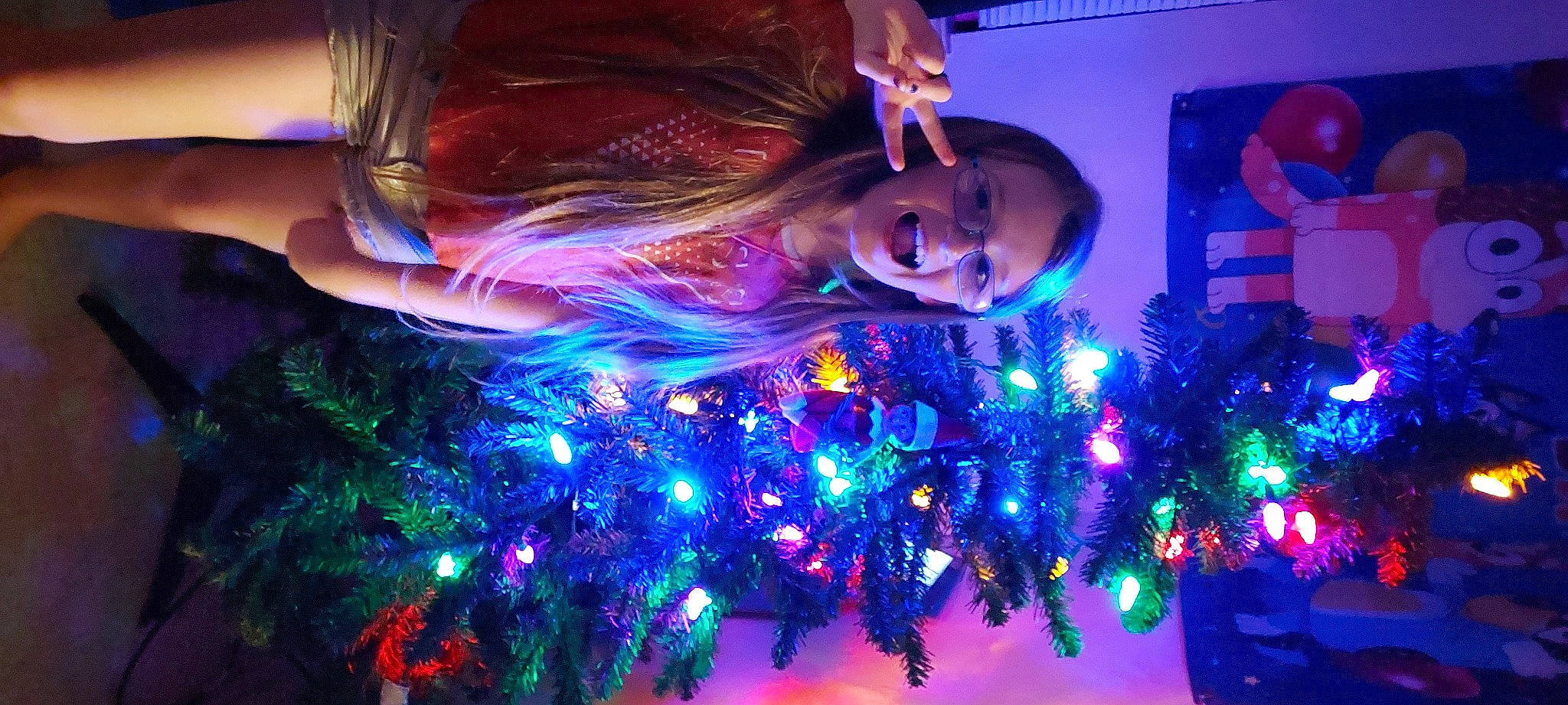 Natalie joined the competition — help win amazing prizes! christmas_decoration, christmas_ornament, christmas_tree, electric_blue, entertainment, event, fun, holiday, holiday_ornament, light, magenta, organism, ornament, person, plant, purple, space, technology, tree, visual_effect_lighting