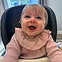 baby, child, high_chair, smiling, happy, indoor, blue_eyes, messy_face, pink_sweater, long_sleeves, infant, cute, looking_up, tongue_out, cozy, home, daylight, furniture, feeding_time, adorable