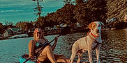Rascal Reid joined the competition — help win amazing prizes! woman, dog, kayak, water, lake, paddle, outdoor, trees, sky, sunlight, summer, nature, recreation, animal, pet, smile, relaxation, adventure, vacation, leisure