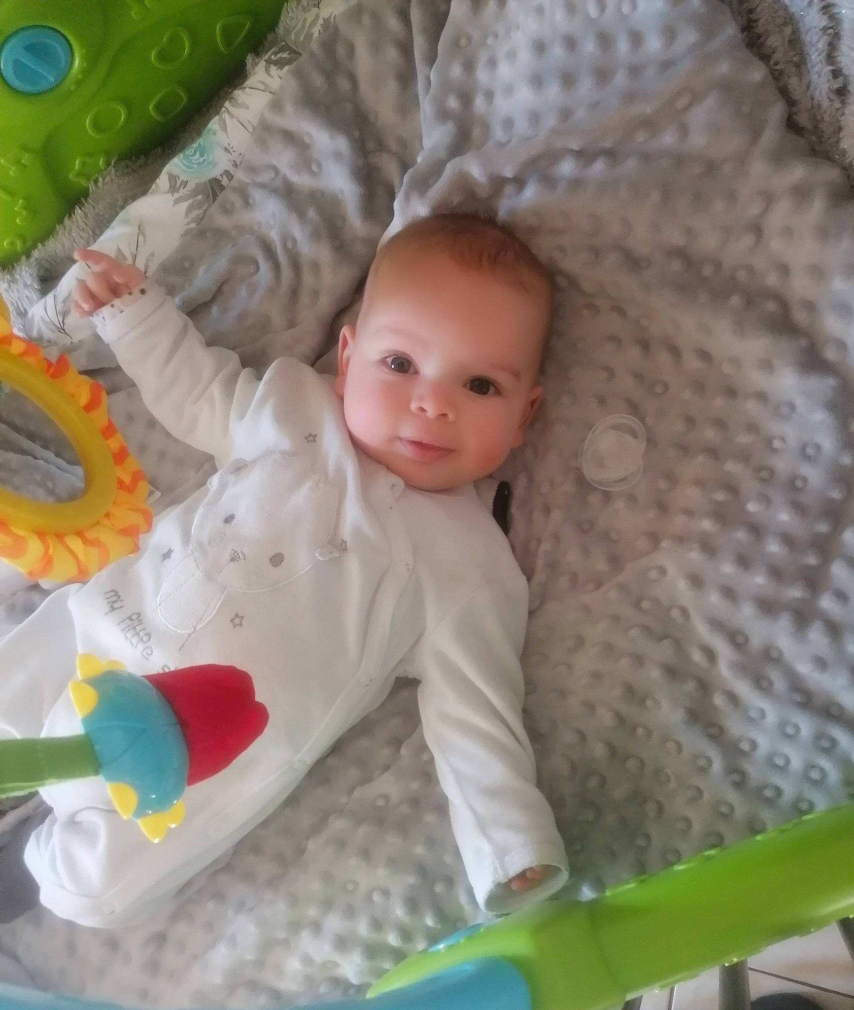 Elidjah participe au concours pour gagner de l'argent avec cette photo : baby, baby_products, baby_toddler_clothing, baby_toys, child, comfort, flooring, fun, grass, green, head, linens, mammal, organ, person, play, sitting, skin, toddler, vertebrate