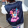 child, girl, hair, ponytails, jacket, kpop, colorful_clothing, pants, outdoor, concrete, pillar, fashion, street_style, casual, standing, back_view, youth, playful, vibrant_colors, person