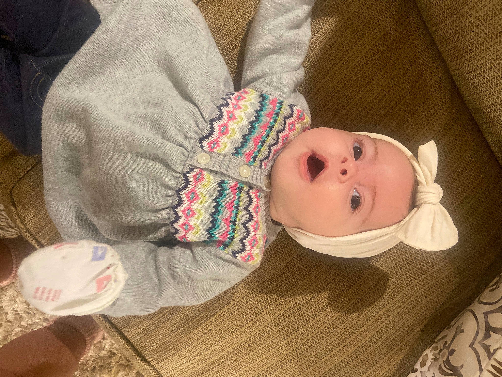 Amayah is registered to the contest to win money with this photo: baby, baby_products, baby_toddler_clothing, cheek, child, comfort, eyelash, flooring, hat, linens, nose, pattern, person, sitting, skin, sleeve, smile, toddler, wood