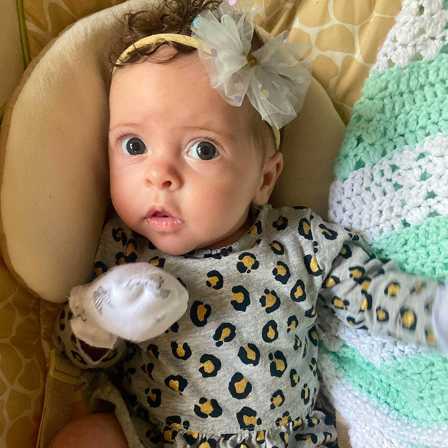 Amayah is registered to the contest to win money with this photo: baby, baby_toddler_clothing, cheek, child, dress, eye, eyelash, face, head, headgear, iris, pattern, person, pink, product, skin, sleeve, textile, toddler, toy