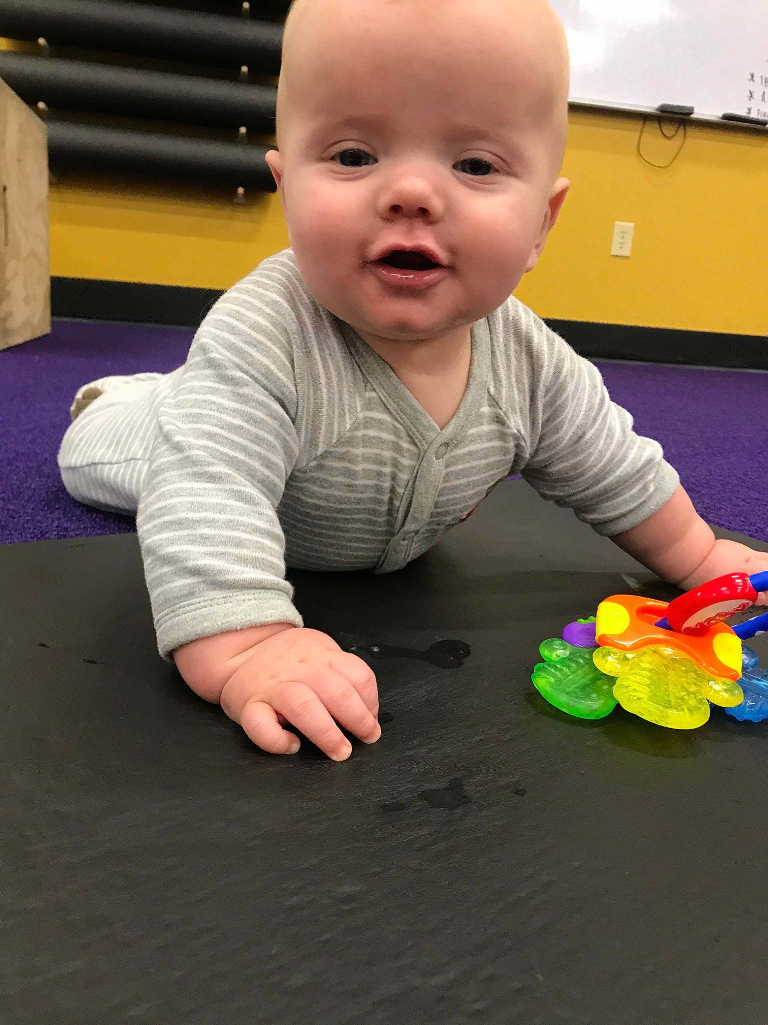 Landen is registered to the contest to win money with this photo: baby, baby_playing_with_toys, baby_toys, cheek, child, crawling, head, person, play, sitting, toddler, toy, tummy_time
