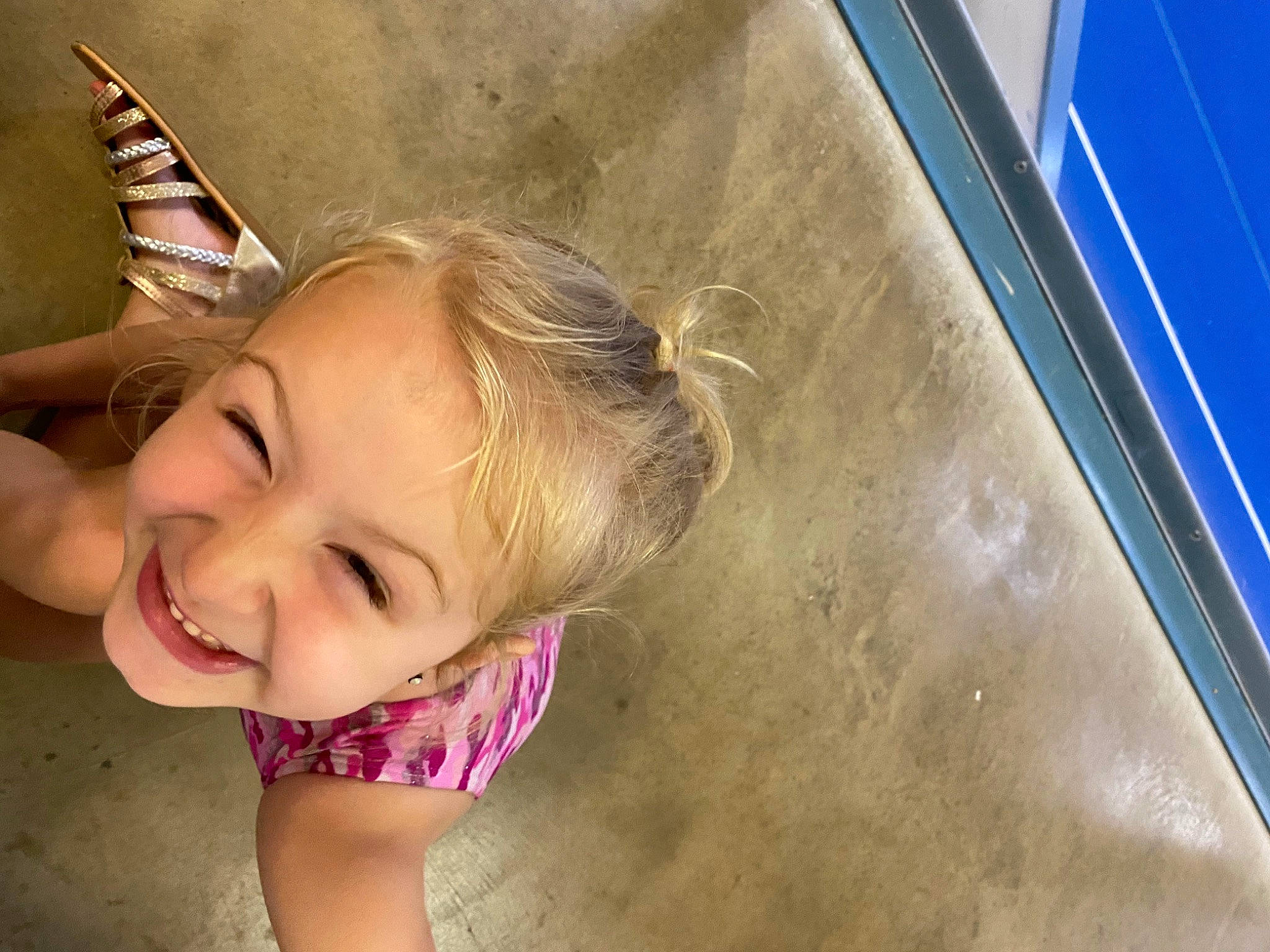 Kylee joined the competition — help win amazing prizes! blond, blue, brown_hair, child, eyewear, fashion_accessory, fun, grass, happy, human_leg, joy, leisure, outdoor_play_equipment, party_hat, person, recreation, sand, sitting, smile, swing