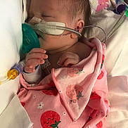 Tinsley joined the competition — help win amazing prizes! baby, newborn, hospital, medical_tube, blanket, pink_blanket, strawberry_pattern, sleeping, infant, nasal_cannula, cute, healthcare, bed, child, person, small_hand, pediatric_care, soft_fabric, rest, patient