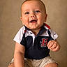 baby, child, smiling, polo_shirt, navy, white, shorts, sitting, happy, portrait, cute, innocent, face, hands, indoor, studio, background, clothing, person, toddler