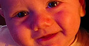 Kingslee joined the competition — help win amazing prizes! baby, face, close_up, smile, child, infant, portrait, skin, eyes, warm_light, expression, head, cute, young, person, indoors, colorful_light, cheeks, nose, mouth
