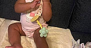 Jae'Onti joined the competition — help win amazing prizes! baby, child, infant, onesie, toy, blanket, couch, smiling, happy, sitting, indoors, playful, cute, skin, hand, foot, face, expression, clothing, furniture